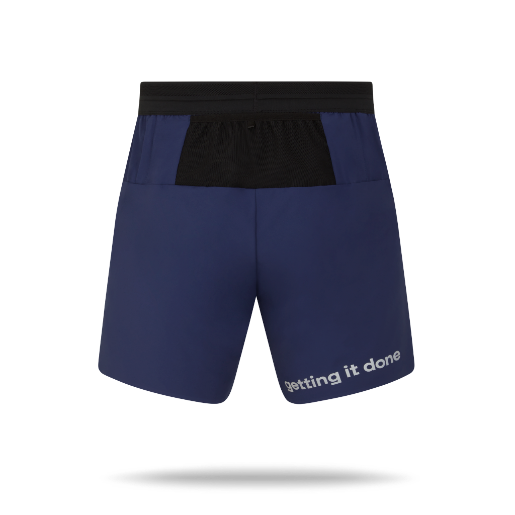 Navy blye shorts with black waistband, showing pockets for storing items.
